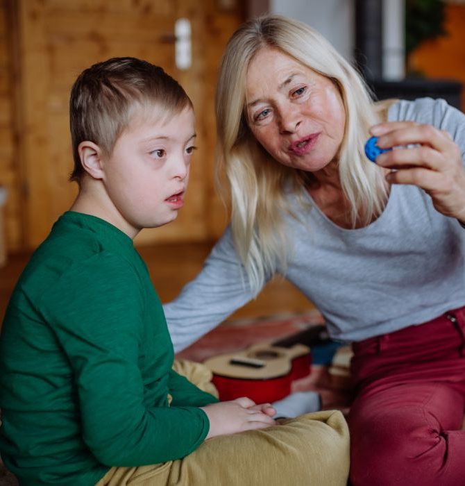 woman-and-child-playing-with-a-blue-toy